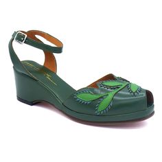 A 1940s era ankle strap wedge with leafy leather cut-out appliques on the vamp. Leather uppers with leather soles 2” wedge heel with a ½” platform Imported Sizing The Flora comes in U.S. Women's whole sizes 5-11.  It runs true to size and is somewhat roomy in the toe box, making it a style that can work well for people Green Woman, Grad Outfits, Leather Cuts, Ankle Strap Wedges, Strap Wedge, Shoe Repair, Shoe Company, Box Making, Measuring Tape