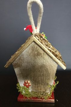 an ornament made to look like a bird house