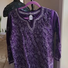 Cotton Purple With White Embroidery. Purchased At Tge Srf Gift Shop In Encinitas. Never Worn W Tags Long Sleeve Purple Kurta For Spring, Spring Purple Embroidered Cotton Top, Long Sleeve Cotton Tunic With Intricate Embroidery, Cotton Long Sleeve Tunic With Intricate Embroidery, Purple Embroidered Long Sleeve Kurta, Cotton Tunic With Intricate Embroidery And Long Sleeves, Cotton Tunic With Embroidered Neckline And Long Sleeves, Summer Embroidered Purple Kurta, Embroidered Bohemian Purple Kurta