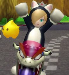 mario kart on a motorcycle with his arms in the air