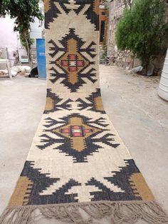 an old rug is laying on the ground