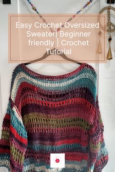 a crocheted sweater hanging on a hook with the text easy crochet oversize sweater beginner friendly crochet