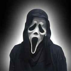 a man in a black hoodie with a white mask on his face and mouth