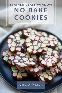 chocolate and marshmallow barkies on a black plate with white cloth in the background