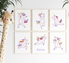 a giraffe is standing next to four unicorns on the wall, each with their own name