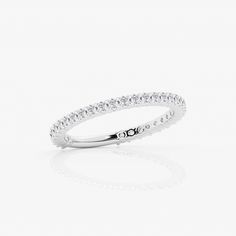 a white gold ring with round diamonds