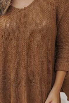 This sweater is expertly crafted for ultimate comfort and style! The Ultimate Loose Fitted Sweater in Brown boasts a wide neckline and 3/4 sleeves with permanent rolled cuffs. Fashioned from a soft and durable knit material, this loose fit sweater also features side slits for added flair. Made with 65% acrylic and 35% nylon for a cozy and luxurious feel. Style with jeans, ankle booties, a wide brim hat, and matching accessories for a chic fall outfit! Open Knit Batwing Sleeve Sweater For Fall, Fall Open Knit Sweater With Batwing Sleeve, Fall Open Knit Batwing Sleeve Sweater, Fall Batwing Sleeve Open Knit Sweater, Knit Sweater With 3/4 Sleeves, Winter Stretch Sweater With 3/4 Sleeves, Winter Sweater With 3/4 Sleeves And Stretch, Casual Knit Sweater With 3/4 Sleeve, Casual 3/4 Sleeve Sweater For Layering