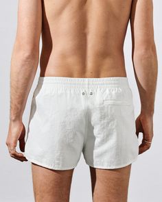 Our Swim Shorts in nylon poplin are designed with a regular fit, short leg and mesh lining for comfort and support. Made of recycled polyamide in a soft mid-weight with a slightly brushed finish.    Regular fit, short leg  Inside leg length size M 6.5 cm/2.6"  Fits true to size   Mesh lining for comfort and support   Elastic waistband with drawstring   Side seam pockets and back zip pocket for secure credit card storage   CDLP branded metal eyelets     Quick-drying   No-tag construction   Style White Shorts For Beach Season Outdoor Activities, White Beach Season Shorts For Outdoor, White Shorts For Outdoor Beach Season, White Beach Season Outdoor Shorts, White Bottoms For Beach Season Outdoor Activities, White Beach Season Bottoms For Outdoor, White Bottoms For Outdoor Beach Season, Nylon Bottoms With Built-in Shorts For Beach Season, White Short Swim Trunks For Outdoor