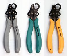 three pairs of pliers sitting next to each other