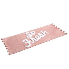 a pink towel with the words be nice on it and pom - poms