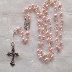 Childs metal rosary kids rosary baby rosary small pink Pink Rosary With 8mm Round Beads, Pink Beaded Rosary With Round Beads, Handmade Pink Spiritual Rosary, Adjustable Pink Cross Rosary, Pink Rosary With Round Beads For First Communion, Pink Rosary With Miraculous Medal As A Gift, Pink Rosary For First Communion, Handmade Pink Rosary With Round Beads, Pink Beaded Rosary