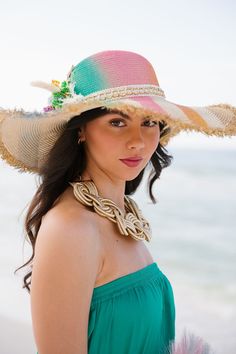 Bask in the sun with our Tropical Sunshine Sun Hat! The playful rainbow stripes add a pop of color while the cream and gold band adds a touch of elegance. Featuring white and gold feathers, bright flowers, and a gold sequin sun patch, this hat is perfect for adding some fun to your summer outfit. This hat is ONE OF A KIND, created by our owner Stephanie. To receive item quicker, expedited shipping is available at checkout. Gold Feathers, Gold Sequin, Bright Flowers, Cream And Gold, Rainbow Stripes, Sun Hats, Gold Bands, Some Fun, Color Pop