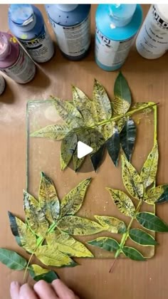 someone is making some leaves out of paper