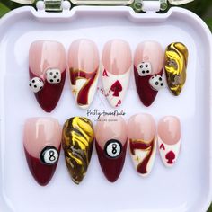 a white case filled with lots of different types of nail art on top of each other