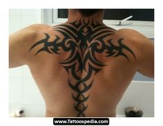 a man with a tattoo on his back