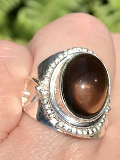 Smoky Quartz Ring Size 7 - Morganna’s Treasures Spiritual Brown Cabochon Jewelry, Spiritual Silver Smoky Quartz Jewelry, Spiritual Round Crystal Healing Ring, Brown Round Jewelry For Healing, Spiritual Healing Crystal Ring, Silver Crystal Ring For Healing, Spiritual Oval Crystal Ring With Large Stone, Brown Oval Spiritual Jewelry, Spiritual Large Stone Crystal Promise Ring