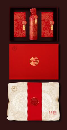 an open red box containing three bottles and two boxes with chinese writing on them, sitting next to each other