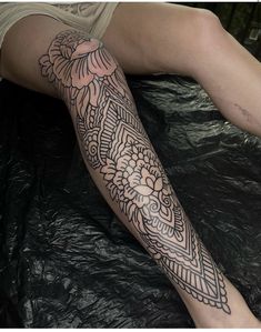 a person with a tattoo on their leg