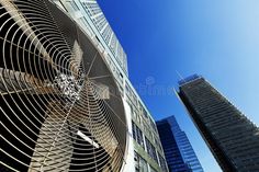 an air vent in the middle of two buildings with skyscrapers in the background royalty images