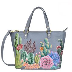 Anuschka style 693, Medium Tote. Desert Garden painting in grey color. Top zip entry, Removable handle with full adjustability. Hand Painted Rectangular Satchel, Hand Painted Crossbody Bags For Travel, Hand Painted Crossbody Travel Bag, Hand Painted Satchel Bag For Everyday Use, Hand Painted Shoulder Bag For Travel, Hand Painted Blue Leather Bags, Rectangular Hand Painted Travel Shoulder Bag, Everyday Hand Painted Shoulder Bag, Hand Painted Tote Shoulder Bag For Everyday