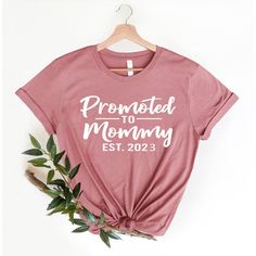 "Introducing the \"Promoted to Mommy\" shirt - the perfect gift for new moms! This cool mom shirt is a unique and fun way to celebrate the new addition to the family. It's a great new mom gift that will make her feel special and loved. Made from high-quality, soft and comfortable material, this shirt is perfect for everyday wear. The design features the words \"Promoted to Mommy\" in bold, eye-catching letters, making it a statement piece that is sure to get noticed. The shirt comes in a variety New Mom Shirts, Cool Mom Shirt, Groovy Mama, Mommy Shirt, New Mommy, Mama Tshirts, Mommy Shirts, Mama T Shirt, Cool Mom