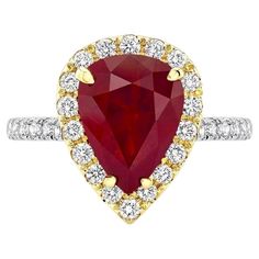 18K white and yellow gold ring, featuring a dazzling 3.82-carat, pear-shaped Burmese Ruby, surrounded by 30 round white diamonds weighing 0.58 carats. This rare Ruby is GIA certified. Burmese Ruby, Pear Ring, Yellow Gold Ring, Ruby Ring, Burmese, Jewelry Rings Engagement, White Diamonds, Yellow Gold Rings, Pear Shaped