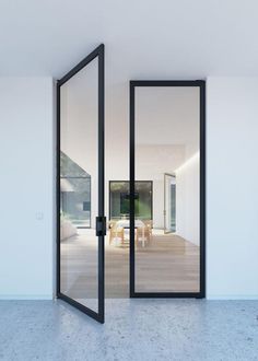 an empty room with glass doors leading to the outside