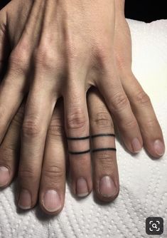 two people with matching rings on their fingers