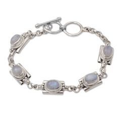 Elegant links are crafted of sterling silver circling the wrist in this bracelet from Bali. Buana designs the bracelet adding a natural rainbow moonstone to each link for an accessory that brings a misty charm to the wearer. Spiritual Sterling Silver Moonstone Bracelet, Silver Bohemian Moonstone Bracelets, Bohemian Silver Moonstone Bracelets, Heart Dangle Earrings, Moonstone Bracelet, Natural Rainbow, Silver Cuff Bracelet, Jewelry Packaging, Silver Cuff