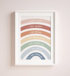 a framed poster with the words i am kind of small, i am brave in rainbow colors