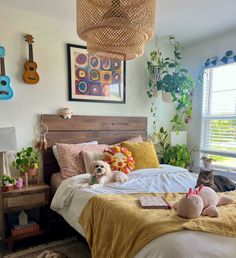 a dog laying on a bed in a bedroom with lots of plants and decorations around it