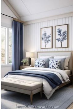 a bedroom with blue and white decor on the walls