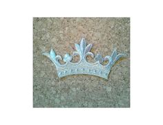 a tiara sitting on top of a stone floor