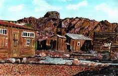 a painting of an old town with mountains in the back ground and rocks on the ground