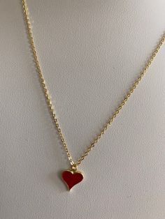 Love this red heart enamel gold necklace that can also be flipped and worn as just a gold heart necklace! Gold Heart Necklace With Heart Print For Valentine's Day, Elegant Enamel Necklace For Valentine's Day, Elegant Enamel Necklace With Heart Charm, Enamel Heart Charm Necklace For Valentine's Day, Valentine's Day Enamel Heart Pendant Necklace, Red Heart Pendant Necklace With Clavicle Chain, Gold Heart-shaped Enamel Necklace, Gold Enamel Heart Necklace For Valentine's Day, Heart-shaped Gold Enamel Necklace