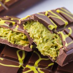 the chocolate bar has avocado on it and is cut in half to look like something