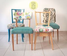 three colorful chairs sitting next to each other in front of a sign that reads sopa