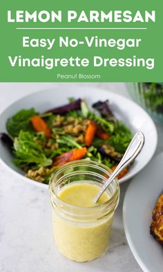 lemon parmesan sauce in a mason jar next to a plate of vegetables and salad