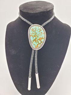 Kingman gem grade Turquoise Bolo Tie. This turquoise is from The Julian Collection. High grade stone, set in sterling. Simple and timeless, this will certainly make a statement. Absolutely stunner stone in this bolo. Well worth the price! All of the turquoise chosen for my bolo ties is absolutely some of the best old stock that can be found. Always priced fairly to ensure value, these are heirloom caliber. Handmade Luxury Turquoise Jewelry, Luxury Handmade Turquoise Jewelry, Adjustable Turquoise Ring With Gemstones, Adjustable Turquoise Jewelry With Stone Setting, Southwestern Adjustable Jewelry With Stones, Turquoise Necklace With Gemstone Accents, Adjustable Turquoise Ring With Stones, Artisan Turquoise Jewelry For Formal Occasions, Elegant Adjustable Turquoise Gemstone Necklace