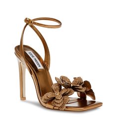 Shimmering rhinestone-accented flower embellishments on the toe strap add a dazzling touch to these women's Steve Madden Ulyana bronze (gold) high heel evening sandals. Made of synthetic upper with a metallic finish, these dressy sandals have a trendy square open toe and an adjustable ankle strap with buckle closure for a precise fit. Synthetic lining and a lightly padded footbed cradle your feet while the synthetic sole offers grip. A towering stiletto heel lends a major style boost. | Steve Ma Butterfly Heels, Ankle Wrap Heels, Gold High Heels, Dressy Sandals, Steve Madden Heels, Evening Sandals, Wrap Heels, Wedding Heels, Gold Heels