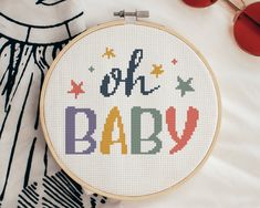 a cross stitch pattern with the words'oh baby'on it next to sunglasses