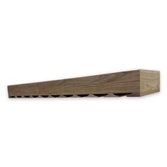 a wooden shelf with four holes in it