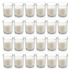 a set of twelve glasses filled with milk