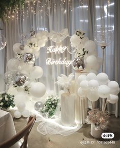 balloons and flowers are on display at a birthday party for someone's special occasion