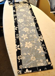 a white surfboard sitting on top of a table