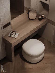 a white stool sitting next to a wooden table with a mirror on top of it