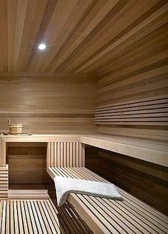 the inside of a wooden sauna with two benches