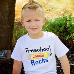 It's back to school time! Help your little one stroll into school with our Preschool Rocks Design Tee. Order options: Personalize with first name Select thread color for name Styles Girls short sleeve puff Girls short sleeve puff with ruffle bottom Unisex short sleeve Unisex raglan sleeve Girls puff tee sizes 12mo, 18mo, 2T, 3T, 4T, 5T, 6, 8, 10 Unisex tee sizes 12mo, 18mo, 2T, 3T, 4T, 5T, 6, 8 Raglan tee sizes 12mo, 18mo, 2T, 3T, 4T, 5T, 6, 8, 10 School Spirit Short Sleeve Tops, School Spirit Tops For Daycare And Back To School, Daycare Tops For Back To School With School Spirit, Short Sleeve T-shirt For Daycare, School Spirit Short Sleeve T-shirt, Short Sleeve T-shirt For School Spirit, Preppy Short Sleeve School T-shirt, Preppy Short Sleeve T-shirt For School, Cute Short Sleeve T-shirt For Students