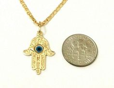 "18K GOLD FILLED HAMSA WITH EVIL EYE NECKLACE 22\" LONG...FOR GOOD LUCK ,PROSPERITY AND PROTECTION. PENDANT : 23x16mm 18K GOLD FILLED CADENA DE MANO DE FATIMA Y OJO DE LA BUENA SUERTE 22\" LARGO ..PARA PROSPERIDAD, BUENA SUERTE Y PROTECCION. DIJE: 23x16mm" Handmade 14k Gold Jewelry For Good Luck, Adjustable Gold Star Of David Jewelry, Yellow Gold Evil Eye Jewelry For Good Luck, Gold Dangle Jewelry With Evil Eye, 14k Gold Filled Evil Eye Jewelry, 14k Gold Evil Eye Charm Necklace, Gold Spiritual Jewelry With Evil Eye, Traditional Gold Evil Eye Necklace, Protection Pendant