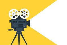 a movie camera on a tripod in front of a yellow and white background